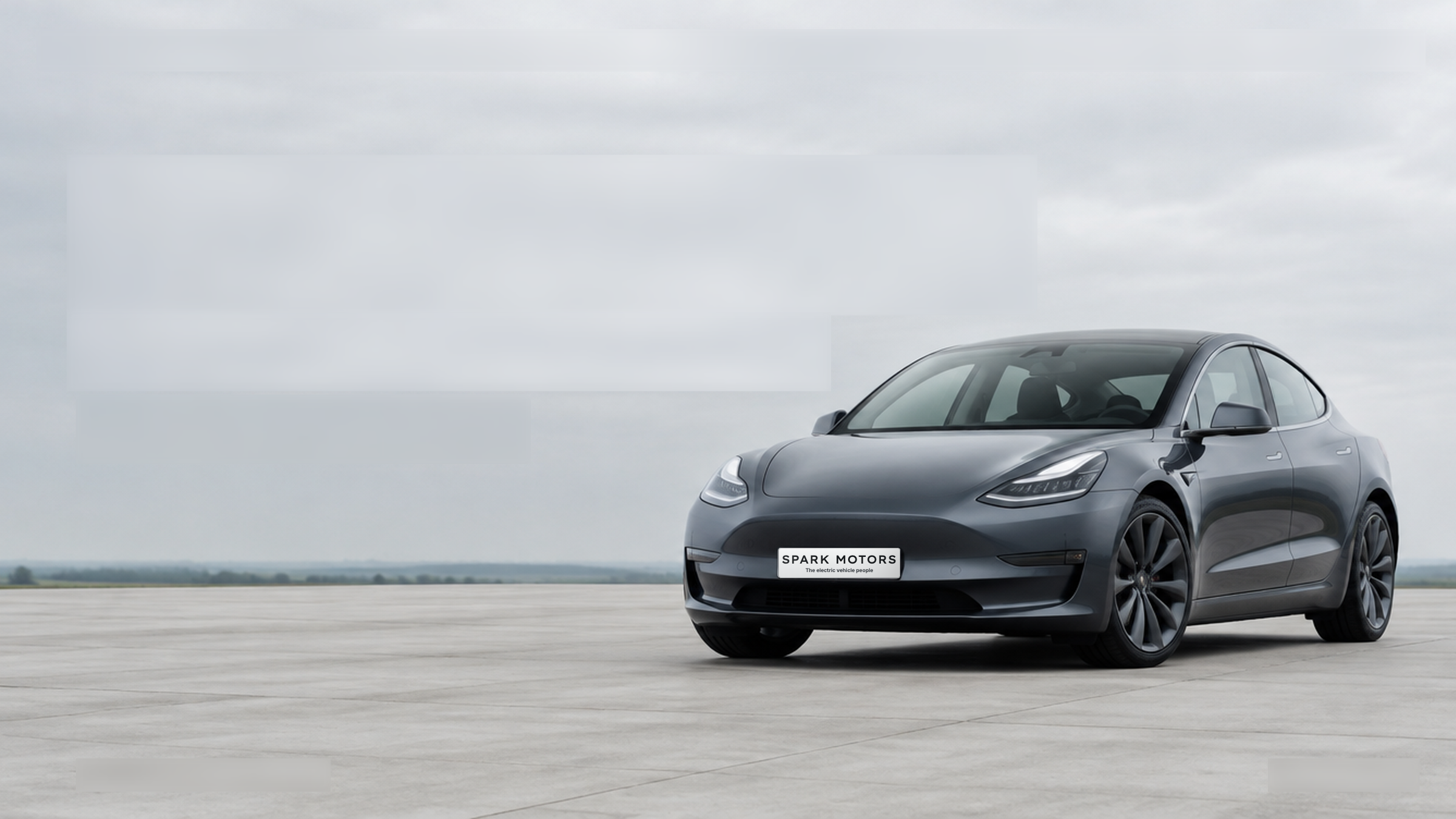 A white Tesla Model 3 at the Spark Motors showroom